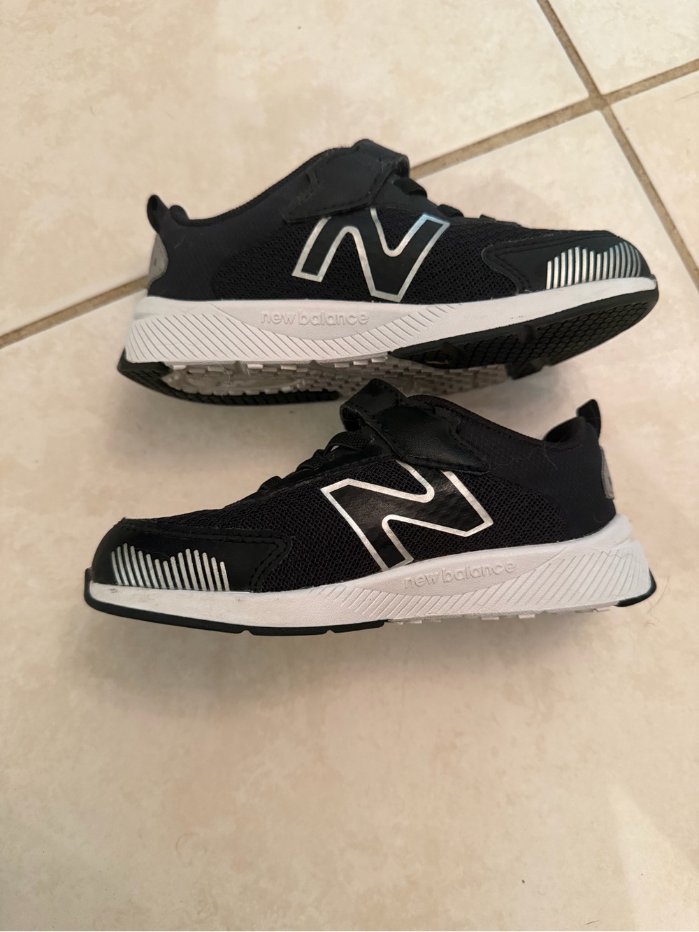 New Balance Kids Black and White Slip-On Athletic Sneakers